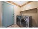 The laundry room features a side-by-side washer and dryer for your convenience at 2229 S 82Nd Ln, Phoenix, AZ 85043