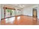 Living room with large windows and doors that view the landscaped backyard at 2229 S 82Nd Ln, Phoenix, AZ 85043