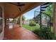 Covered patio overlooking lush backyard with a spiral staircase leading to a rooftop area, perfect for outdoor living at 2229 S 82Nd Ln, Phoenix, AZ 85043