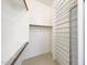 Walk-in closet with wooden and chrome bars and shelving at 2229 S 82Nd Ln, Phoenix, AZ 85043