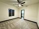 Bright bedroom featuring plush carpet, a modern ceiling fan, and a walk-in closet at 22504 W Meade Ln, Buckeye, AZ 85326