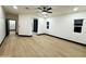 Spacious living room with vinyl flooring, natural light, and access to an elegant bathroom at 22504 W Meade Ln, Buckeye, AZ 85326