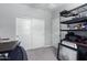 Bedroom with neutral walls, plush carpet, and a closet with sliding doors at 22660 N 122Nd Ave, Sun City, AZ 85373