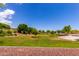 Expansive common area showcases lush landscaping, mature trees, and open green space at 22660 N 122Nd Ave, Sun City, AZ 85373