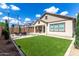 Beautiful backyard with patio seating, manicured lawn, and mature landscaping at 2716 S Chatsworth --, Mesa, AZ 85209