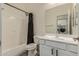 Bathroom featuring shower-tub combination and a white vanity with shaker style doors at 2716 S Chatsworth --, Mesa, AZ 85209