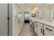 Modern bathroom featuring double vanity, glass shower enclosure and views into the bedroom at 2716 S Chatsworth --, Mesa, AZ 85209