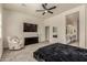 Bedroom featuring a ceiling fan, large dresser and an ensuite bathroom with double vanity at 2716 S Chatsworth --, Mesa, AZ 85209