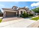 Beautiful exterior view of home featuring an attached garage, landscaped yard, and covered porch at 2716 S Chatsworth --, Mesa, AZ 85209