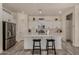 Bright eat-in kitchen with stainless appliances, white cabinets and island with counter seating at 2716 S Chatsworth --, Mesa, AZ 85209