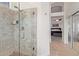 Modern bathroom with a glass-enclosed shower and a view to the main bedroom at 3089 E Indigo Bay Dr, Gilbert, AZ 85234
