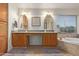 Bathroom boasts dual sinks, granite countertops, and a relaxing soaking tub at 3089 E Indigo Bay Dr, Gilbert, AZ 85234