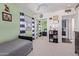 Charming bedroom featuring a mirrored closet, carpet floors, and a ceiling fan at 3089 E Indigo Bay Dr, Gilbert, AZ 85234