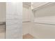 Walk-in closet with built-in shelves, drawers, and hanging rods for ample storage at 3089 E Indigo Bay Dr, Gilbert, AZ 85234