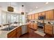 Bright kitchen featuring stainless steel appliances, granite countertops, and seamlessly connecting to dining area at 3089 E Indigo Bay Dr, Gilbert, AZ 85234
