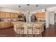Beautiful kitchen featuring granite countertops, a central island with seating, and pendant lighting at 3089 E Indigo Bay Dr, Gilbert, AZ 85234