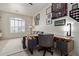 Home office with a built-in desk, decor and a comfortable seating area at 3089 E Indigo Bay Dr, Gilbert, AZ 85234