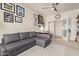 Comfortable home office space with neutral colors and a large sectional sofa at 3089 E Indigo Bay Dr, Gilbert, AZ 85234