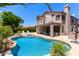 Beautiful backyard pool and patio area, perfect for entertaining and relaxation, with lush landscaping at 3089 E Indigo Bay Dr, Gilbert, AZ 85234