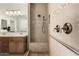 Modern bathroom featuring a tiled shower with built-in seat and glass enclosure with a double sink vanity at 31219 N 6Th Pl, Phoenix, AZ 85085