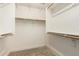Walk-in closet with wood rods and shelves for ample storage at 31219 N 6Th Pl, Phoenix, AZ 85085