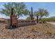Community sign for Sonoran Gate featuring saguaro cactus and desert vegetation at 31219 N 6Th Pl, Phoenix, AZ 85085