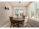 Cozy dining area featuring a round wooden table and lots of natural light at 31219 N 6Th Pl, Phoenix, AZ 85085