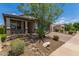 Single-story home with covered porch, two-car garage, desert landscaping with rocks and brick paver driveway at 31219 N 6Th Pl, Phoenix, AZ 85085