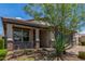 Single-story home with covered porch, desert landscaping with rocks, and a two-car garage at 31219 N 6Th Pl, Phoenix, AZ 85085