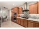 Beautiful kitchen with stainless steel appliances, mosaic backsplash, and granite countertops at 31219 N 6Th Pl, Phoenix, AZ 85085