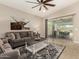 Well-lit living room with patio doors and access to the outdoor dining area at 31219 N 6Th Pl, Phoenix, AZ 85085