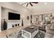 Spacious living room with high ceilings, comfortable seating, and entertainment center at 31219 N 6Th Pl, Phoenix, AZ 85085