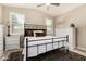 Inviting main bedroom with vaulted ceilings, white dresser, and natural light at 31219 N 6Th Pl, Phoenix, AZ 85085