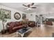 Inviting living room featuring tile flooring, comfortable leather seating, and decorative accents at 3208 W Wagoner Rd, Phoenix, AZ 85053