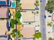 Aerial view of the house showcasing the backyard, landscaping, and surrounding neighborhood at 3511 W Allens Peak Dr, San Tan Valley, AZ 85144