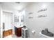 Bright bathroom with vanity, decorative wall signs, and white fixtures creating a modern feel at 3511 W Allens Peak Dr, San Tan Valley, AZ 85144