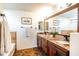 Bathroom with double sink vanity, granite counters and tile at 3511 W Allens Peak Dr, San Tan Valley, AZ 85144
