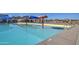 Expansive community pool area with fun water features and plenty of room to relax on a sunny day at 3511 W Allens Peak Dr, San Tan Valley, AZ 85144