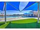 Shaded view of the lovely community pool and playground on a sunny day at 3511 W Allens Peak Dr, San Tan Valley, AZ 85144