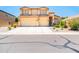 Charming two-story home boasts a spacious three-car garage and well-maintained landscaping at 3511 W Allens Peak Dr, San Tan Valley, AZ 85144