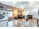 Inviting living room with tile floors, neutral walls, and comfortable leather sofas, offering a cozy gathering space at 3511 W Allens Peak Dr, San Tan Valley, AZ 85144