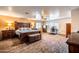 Spacious main bedroom with an ornamental king bed and a ceiling fan at 3511 W Allens Peak Dr, San Tan Valley, AZ 85144