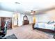 Bright main bedroom with carpet and an ornamental king bed at 3511 W Allens Peak Dr, San Tan Valley, AZ 85144