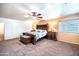 Bright main bedroom featuring an ornamental king bed and carpet at 3511 W Allens Peak Dr, San Tan Valley, AZ 85144