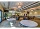 Spacious meeting room with modern lighting, comfortable seating, and a large screen for presentations at 3511 W Allens Peak Dr, San Tan Valley, AZ 85144
