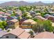 Expansive view of a suburban neighborhood with neat homes and lush trees in the distance at 3511 W Allens Peak Dr, San Tan Valley, AZ 85144