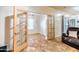Open office space with neutral tile flooring, French doors, and adjacent seating area, great for versatile use at 3511 W Allens Peak Dr, San Tan Valley, AZ 85144