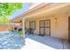 Covered patio featuring outdoor seating, decorative grates, and string lights for relaxed evenings at 3511 W Allens Peak Dr, San Tan Valley, AZ 85144