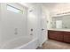 Bathroom with tub and shower, wooden vanity, and tile floors at 37911 N Luke Ln, San Tan Valley, AZ 85140