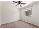 Bedroom features neutral carpet and a bright window at 37911 N Luke Ln, San Tan Valley, AZ 85140